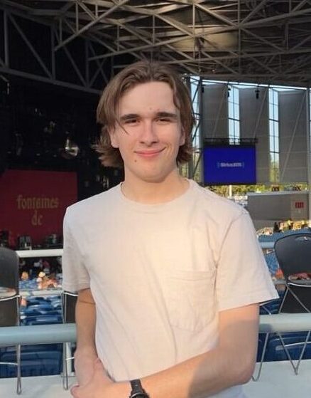 Mitchell Fox leaning on a rail at a concert