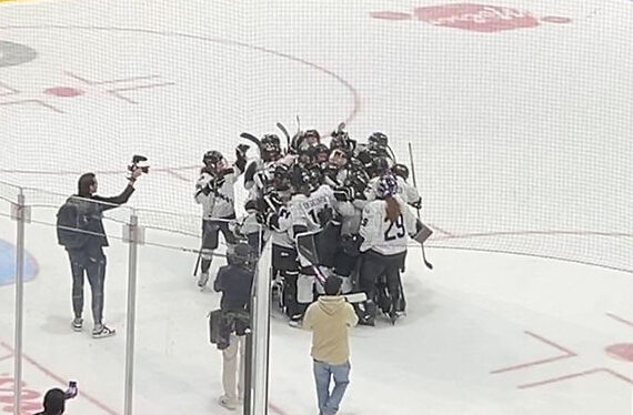 PWHL Minnespta players celebrate at their net